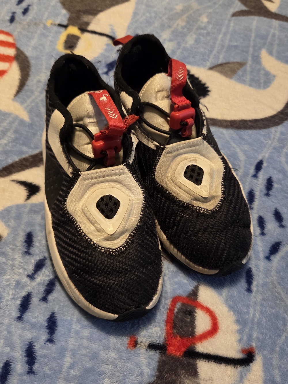 Kids Black and White NIKE LEBRON Athletic Slip-On Shoes with Red Pull Tab